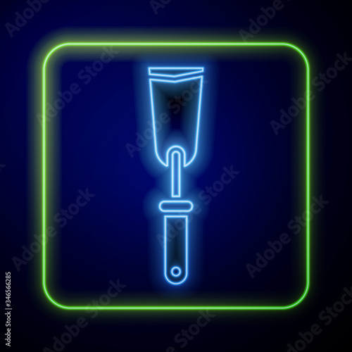 Glowing neon Putty knife icon isolated on blue background. Spatula repair tool. Spackling or paint instruments.  Vector Illustration