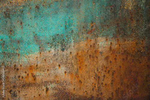 orange texture of rusty iron with traces of blue paint
