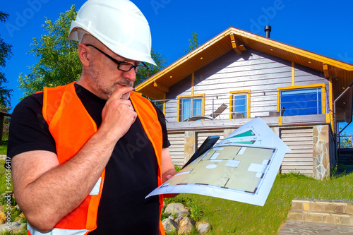 Build. Man in a helmet at a...