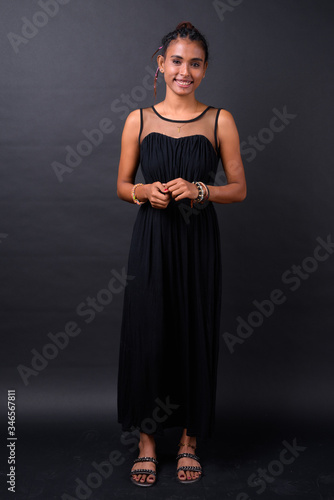 Portrait of young beautiful Asian woman with braids