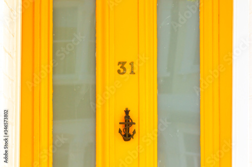 Bright and vibrant house number 31 photo