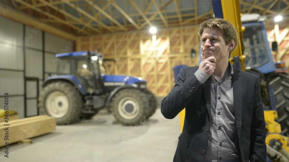 Young handsome businessman thinking inside wooden construction site Young handsome businessman thinking inside wooden construction site