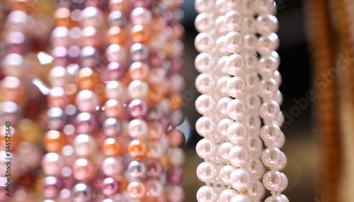 Pearl beads on a pink counter