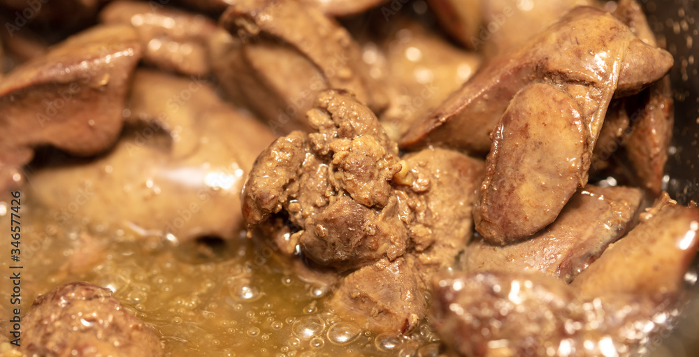 Chicken liver is fried in a pan. Chicken liver is fried in a pan.
