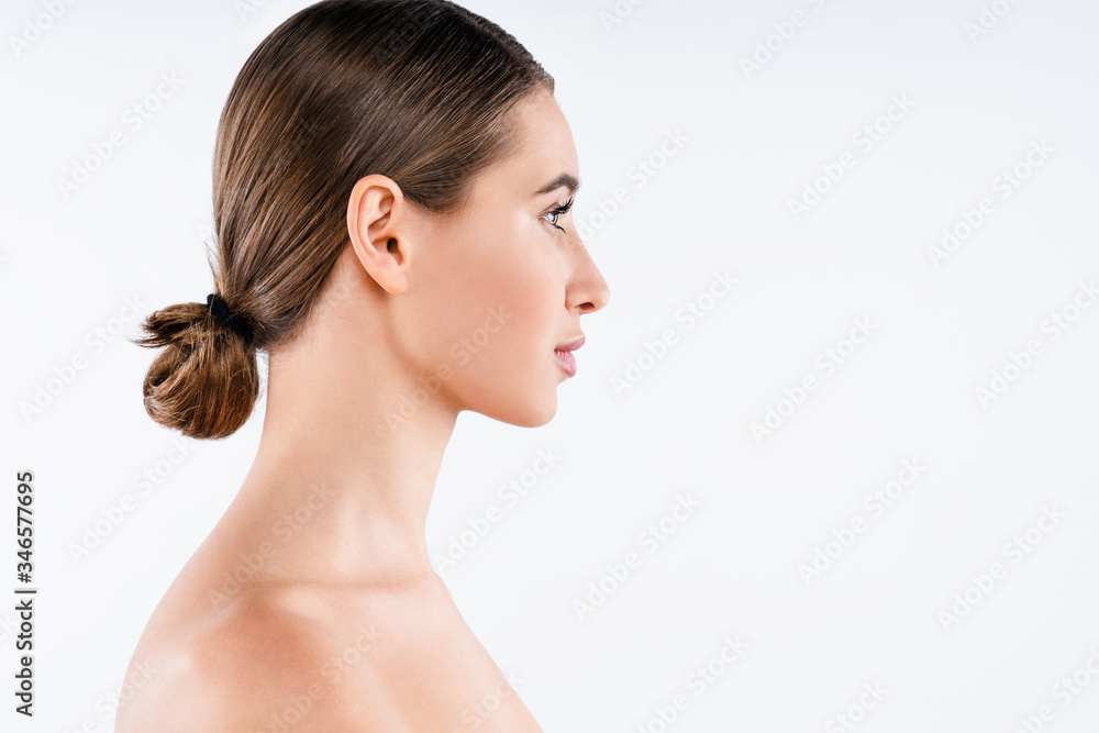 Profile of beautiful young woman with clean skin close up isolated on white background Profile of beautiful young woman with clean skin close up isolated on white background
