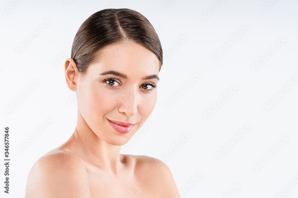 Brunette female looking at camera and smiling. Youth and skin care concept Brunette female looking at camera and smiling. Youth and skin care concept
