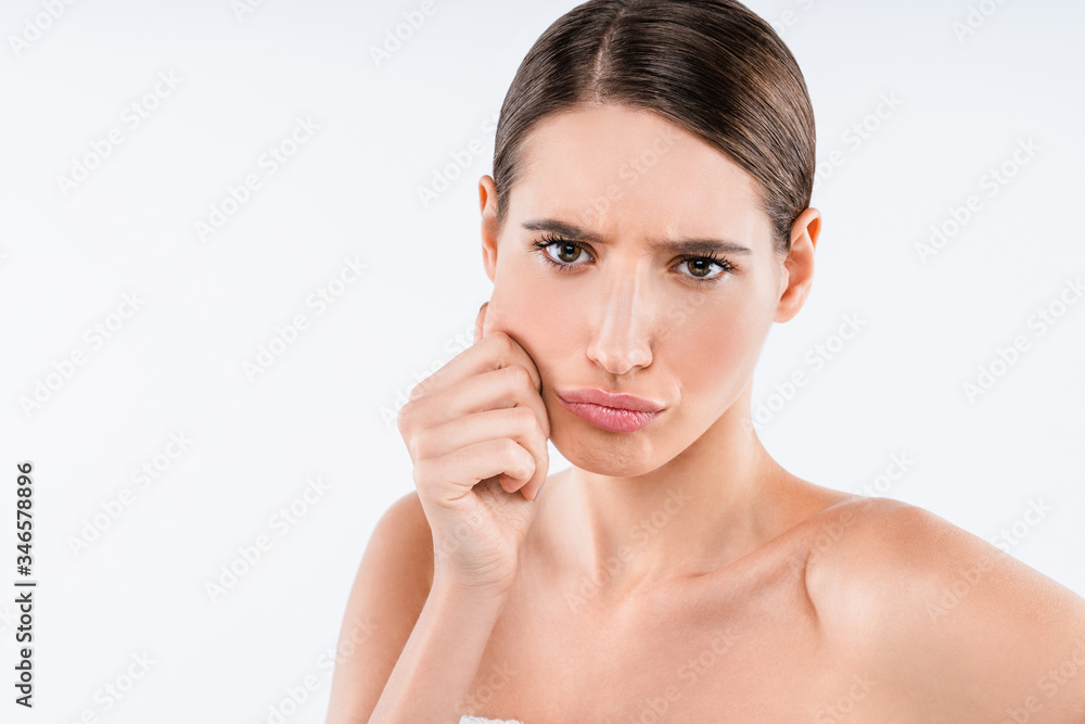 Beauty portrait of young sad half naked woman touching her face isolated over white background Beauty portrait of young sad half naked woman touching her face isolated over white background