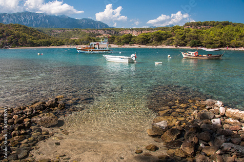 Boat on the clear water of Phaselis Bay