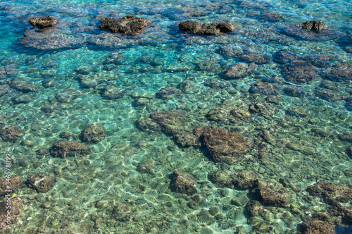 Beautiful stones in the clear water of the Mediterranean Sea
