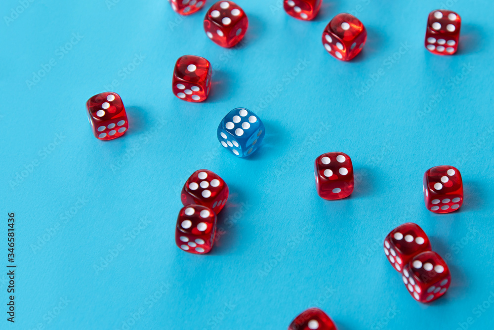 Bright red dice on blue background, difference Bright red dice on blue background, difference