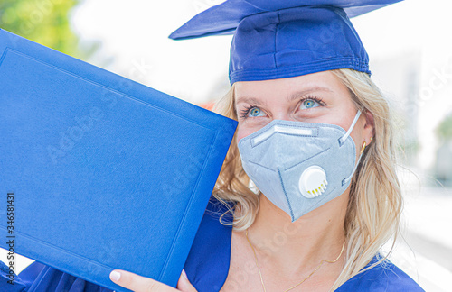 female graduate in cap and gown