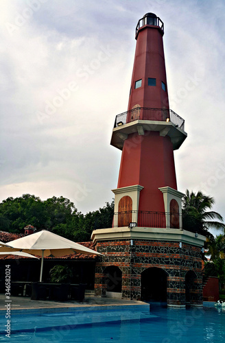 Old lighthouse on the beach of famous 5-star luxury hotel in the Penonomé region of Panama