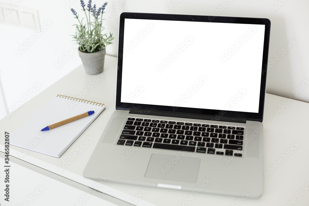 Fototapeta premium Laptop with blank screen on table