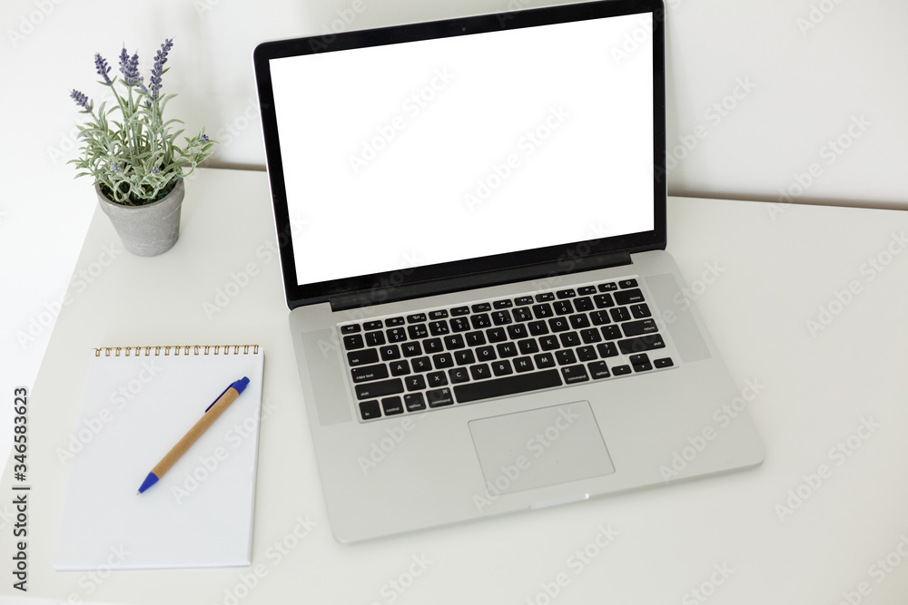 Fototapeta premium Laptop with blank screen on table