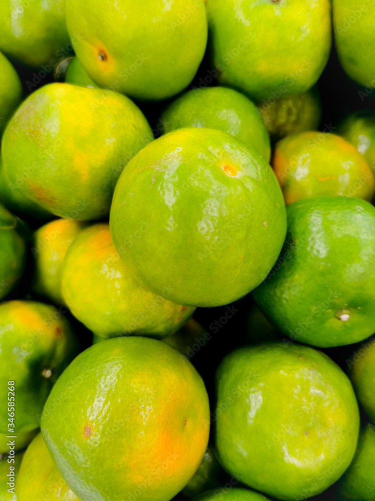 Beautiful texture fresh lemon orange lime tangerine and grapefruit background, fruit orange pattern