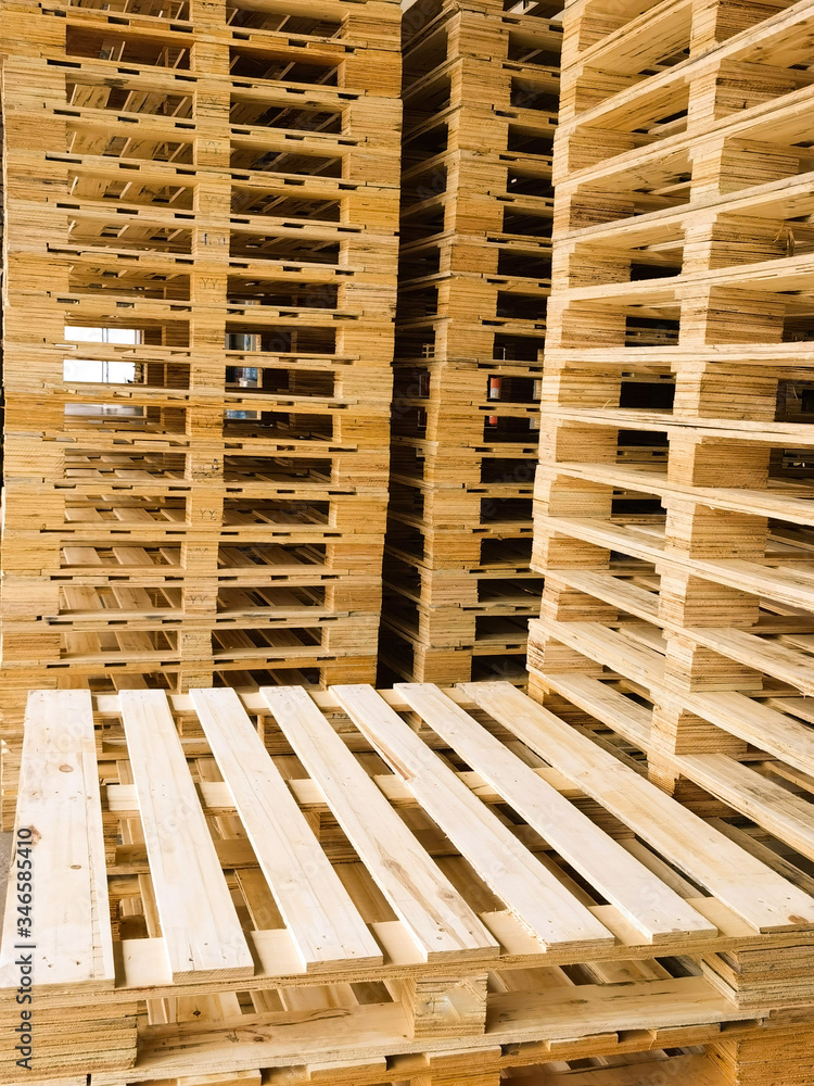 Wooden pallets stack at the freight cargo warehouse for transportation and logistics industrial Wooden pallets stack at the freight cargo warehouse for transportation and logistics industrial