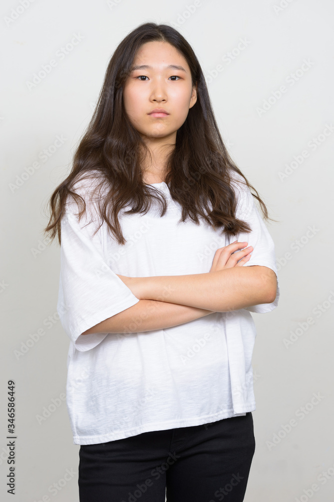 Portrait of young beautiful Asian woman with arms crossed Portrait of young beautiful Asian woman with arms crossed
