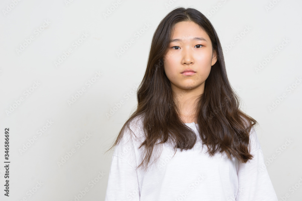 Portrait of young beautiful Asian woman looking at camera Portrait of young beautiful Asian woman looking at camera