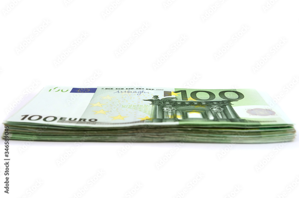 stack with 100 euros isolated on a white background. Side view. A lot of euro banknotes. stack with 100 euros isolated on a white background. Side view. A lot of euro banknotes.