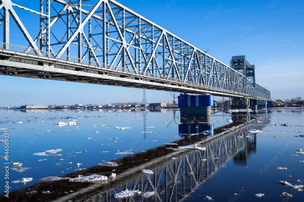 Spring evening in Arkhangelsk. Ice drift on the Severnaya Dvina river. The world's northernmost drawbridge.