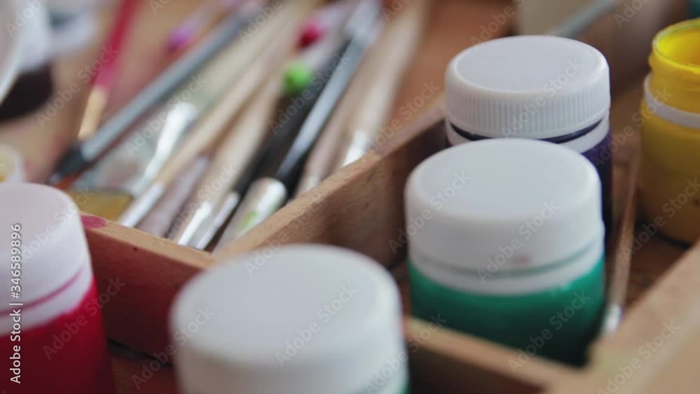 Paints and brushes for painting. Artist's tools close-up. Paints and brushes for painting. Artist's tools close-up.