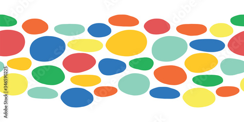 Abstract seamless vector border organic cut out dot shapes blue, red, yellow, green, orange. Repeating pattern hand paper cutting matisse style kids collage. Use for fabric trim, ribbons, kids decor