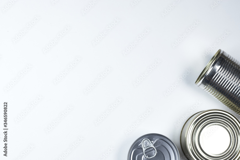 tin cans of different sizes on a white background. copyspace. tin cans of different sizes on a white background. copyspace.