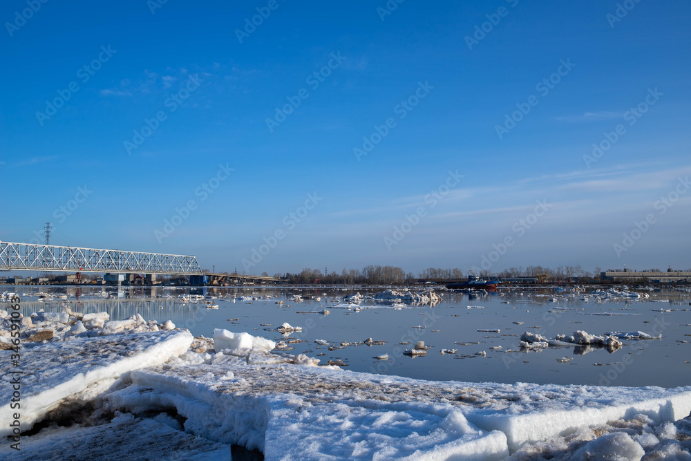 Spring evening in Arkhangelsk. Ice drift on the Severnaya Dvina river. The world's northernmost drawbridge. Spring evening in Arkhangelsk. Ice drift on the Severnaya Dvina river. The world's northernmost drawbridge.