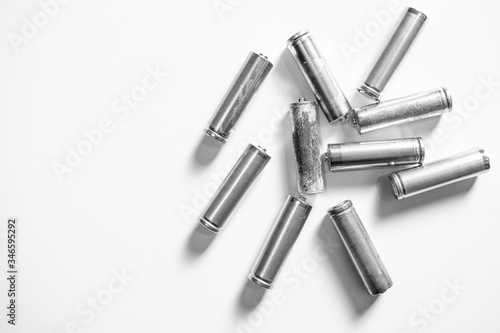 colorless batteries on a white background. one of them is old