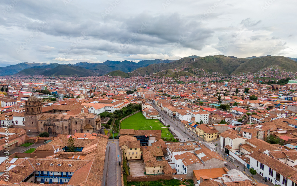 South aerial view over Avenida del Sol and Qorikancha church from Cusco, Peru