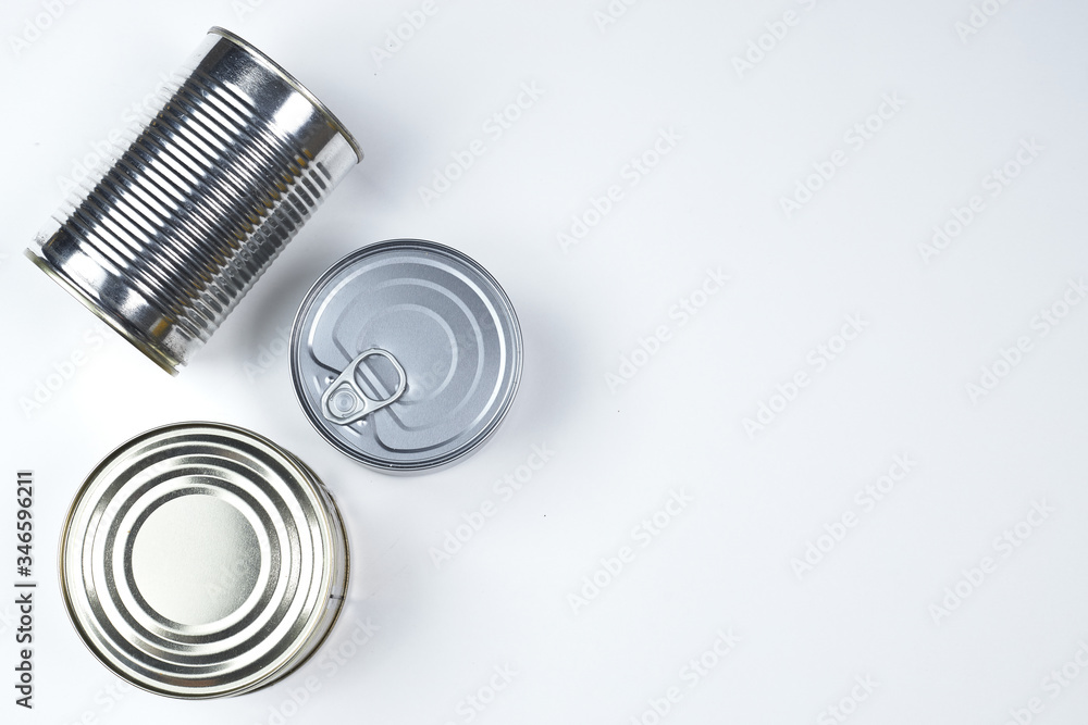tin cans of different sizes on a white background. copyspace. tin cans of different sizes on a white background. copyspace.