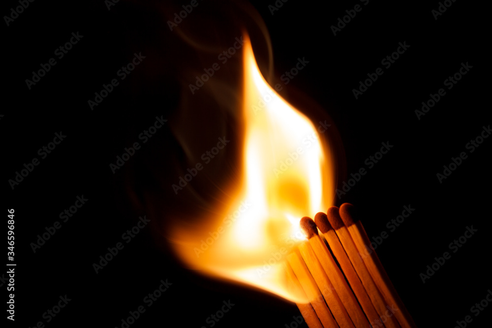 A row of matches being ignited A row of matches being ignited