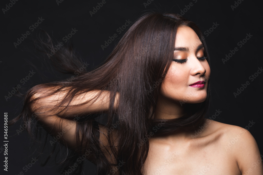 Fototapeta premium Portrait of young asian woman with makeup long hair.