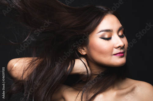 Portrait of young asian woman with makeup long hair.