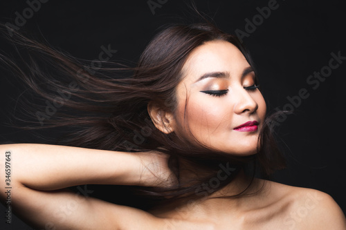 Portrait of young asian woman with makeup long hair.