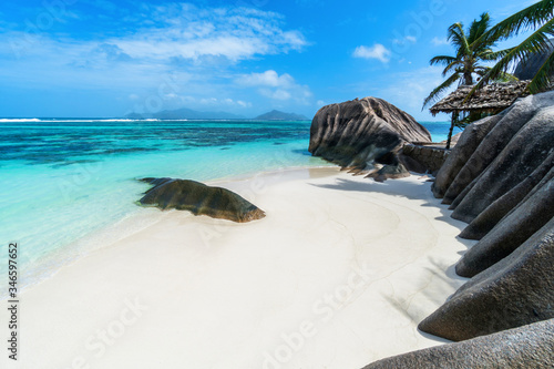 Anse Source d'Argent at La Digue Island, Seychelles. Heavenly beach with dazzling white sands, crystal clear waters, surrounded by beautiful granite boulders and coconut palms.