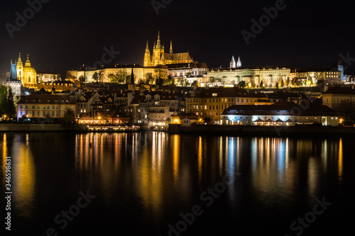 Czech Republic. Cityscape of Prague at night with view of Prague Castle.