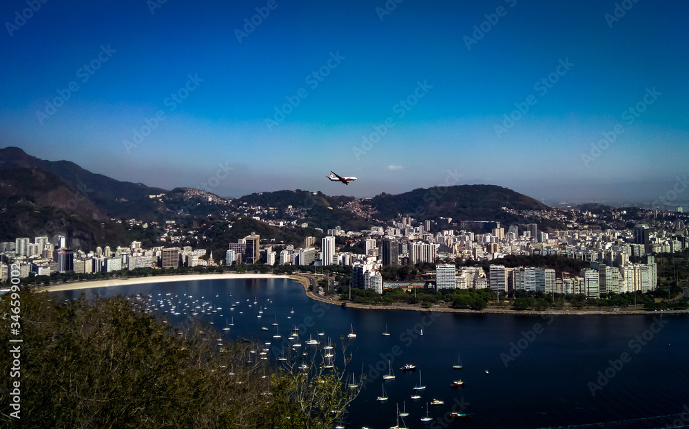 View of Rio de Janeiro with plane overflight, Sugarloaf cable car, Rio de Janeiro, Brazil
