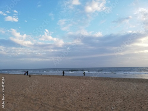 people walking on the beach