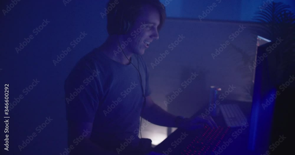 Man playing video games at night