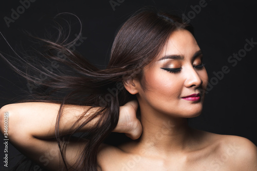 Portrait of young asian woman with makeup long hair.