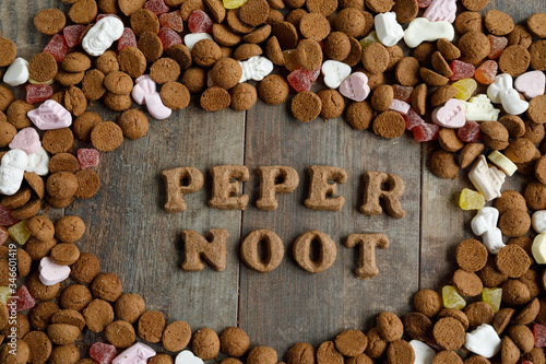 Dutch candy called Pepernoten eaten during Sinterklaas feast. The candy is arranged in the word Pepernoot which is the name of the candy itself which has no English name.