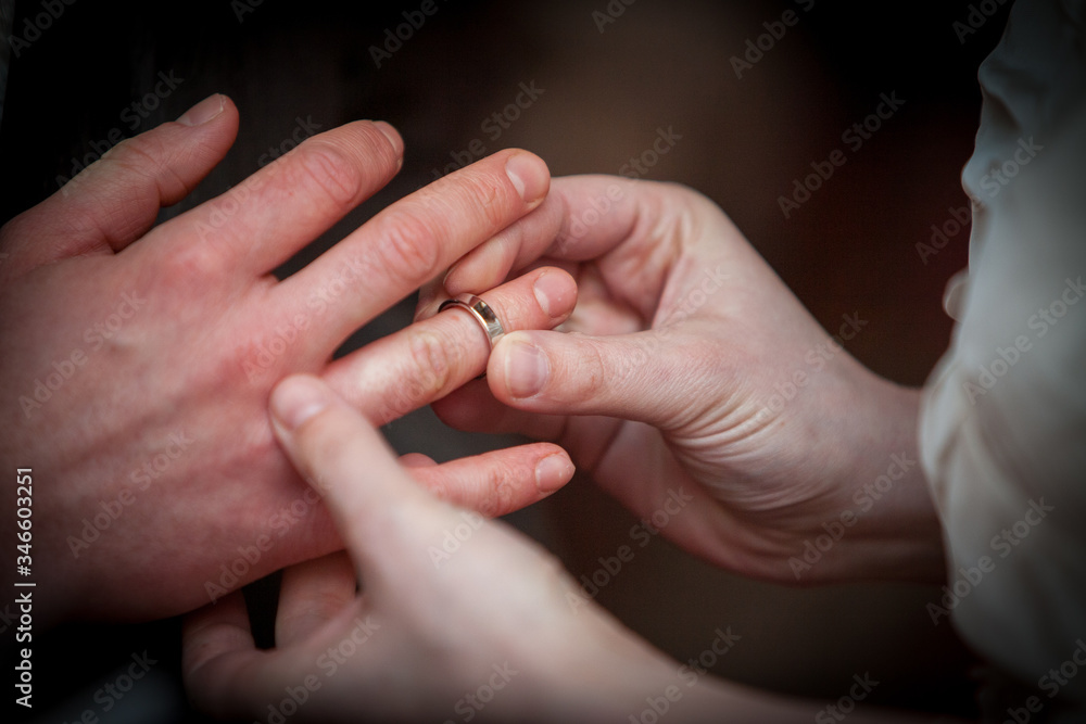 An unrecognizable bride and groom exchanging of the Wedding Rings in church during the christian wedding ceremony An unrecognizable bride and groom exchanging of the Wedding Rings in church during the christian wedding ceremony