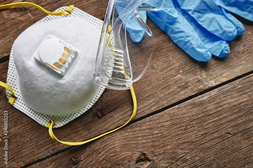 Fotografie personal protection equipment including a face mask, gloves, and glasses