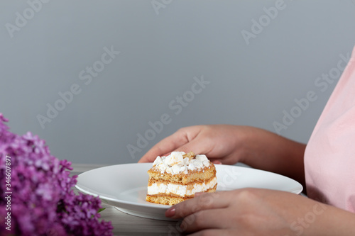 woman eat cake and drink coffee and lilac