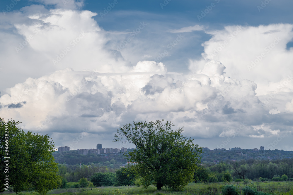 sky after rain with huge clouds. city skyline.