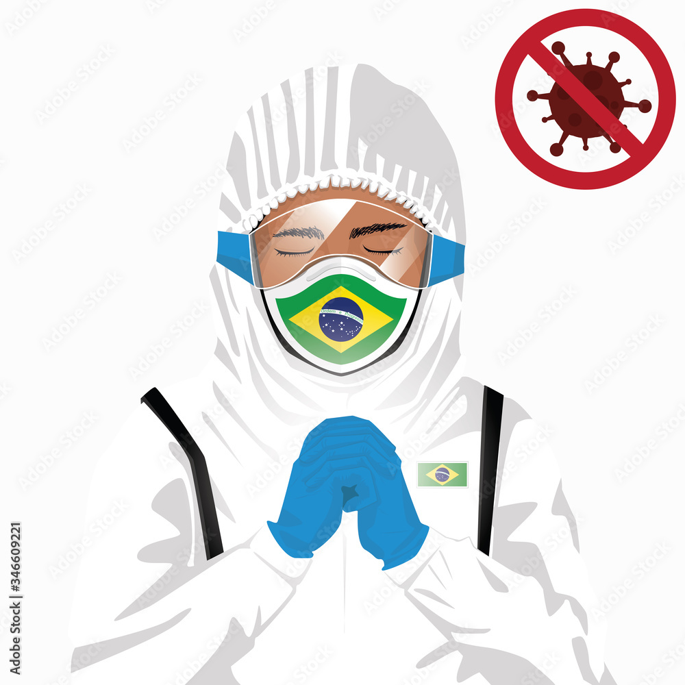 Covid-19 or Coronavirus concept. Brazilian medical staff wearing mask in protective clothing and praying for against Covid-19 virus outbreak in Brazil. Brazilian man and Brazil flag. Epidemic virus