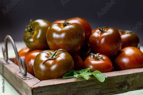 Fresh ripe sweet reddish brown and green kumato tomatoes
