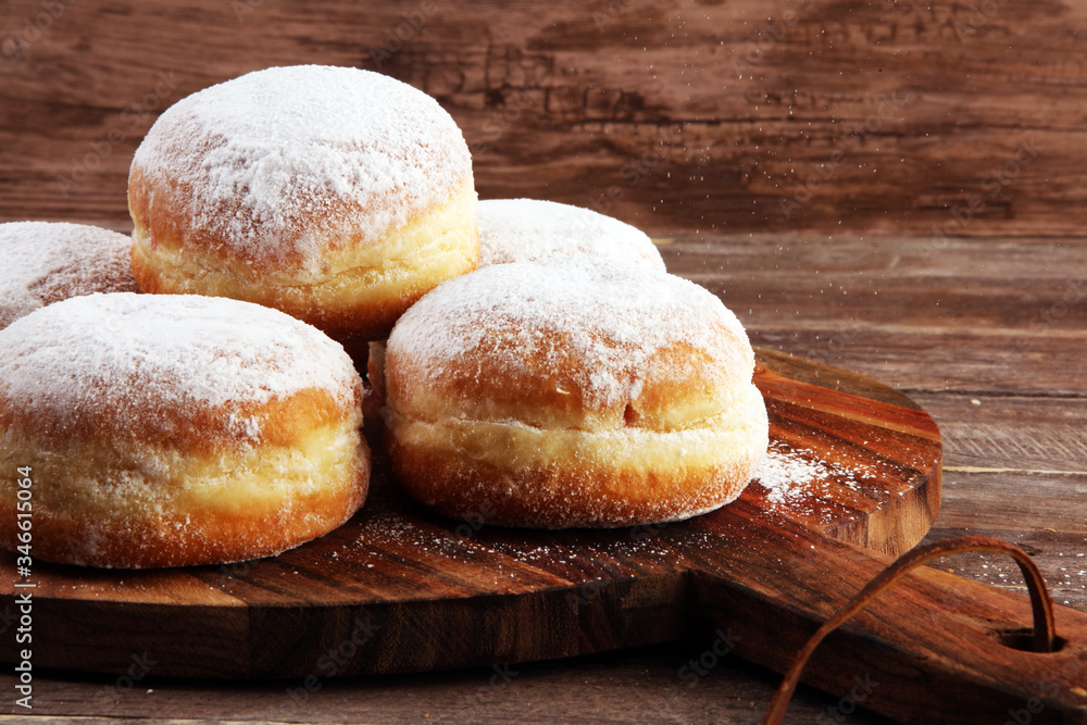 German donuts with jam and icing sugar. Carnival powdered sugar raised donuts for party German donuts with jam and icing sugar. Carnival powdered sugar raised donuts for party