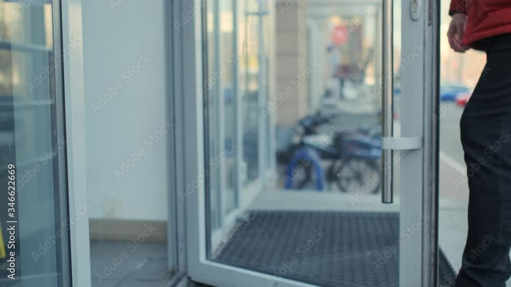 Weird way to open the door. Man opening office door with leg. Entering to the store. Hygiene virus protection concept 4k Weird way to open the door. Man opening office door with leg. Entering to the store. Hygiene virus protection concept 4k
